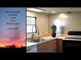 The amount of space available in the middle and the size of the kitchen heavily depends on the model and size. Diy Countertop And Sink Install In The Mobile Home Youtube