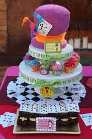 Our signature topsy turvy diaper cake stood as the focal point on the candy buffet. Mad Hatter Baby Shower Online