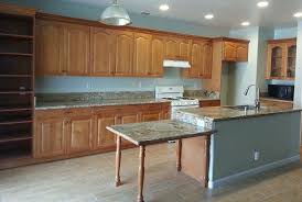 Toffee Arch Cabinets With African Canyon Granite Island Extended To Make A Dining Table Cabinets And Countertops Cabinet Kitchen