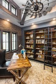 Study was design to be masculine with blue painted built in cabinetry, brick fireplace surround and wall. 75 Beautiful Industrial Home Office Pictures Ideas June 2021 Houzz