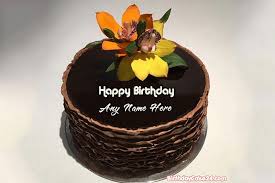 Birthday cakes are often layer cakes with frosting served with small lit candles on top representing the celebrant's age. Write Name On Chocolate Birthday Cake With Flowers