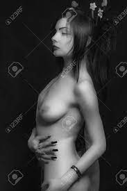 Pretty Young Japanese Woman Undressing Over Dark Background Stock Photo,  Picture and Royalty Free Image. Image 101261693.