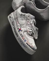 Black Air Forces With White Writing Pin On Hype All Day