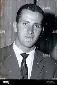 In this Aug. 16, 2012 photo, University of Nebraska-Lincoln student Zhao  Ruobing, center, greets Judy Spaulding, a volunteer with International  Students Incorporated, while her father and traveling companion Zhao Hulin  watches after