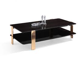 Designed with two tiers, one of transparent glass and the base in black oak, the emulsion black oak coffee table emulates the separation of elements. Modrest Leroy Modern Ebony Rosegold Coffee Table By Vig Furniture