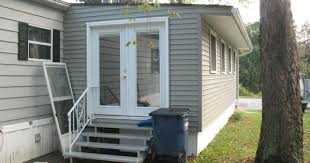 Our vinyl and metal framed patio doors come with the standard mounting frame, screen. Love The French Doors Mobile Home Sunroom After Mobile Home Exteriors Mobile Home Renovations Remodeling Mobile Homes