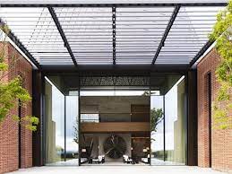 The sliding screen door has spring loaded wheels at the bottom and top frames and slides the track on the outer side of a sliding glass door. The Tallest Heaviest Sliding Glass Door Of All A Case Study Glassonweb Com
