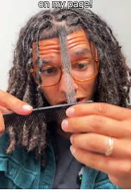 Guy Combs His Dreads