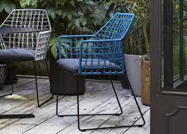 Acacia wood tabletop, stackable armrest chairs with cushions. Saba New York Soleil Garden Chair With Arms Saba Furniture At Go Modern London