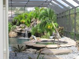 A tradition that is uniquely floridian. Lanai Landscape Water Feature Tropical Garden Miami By Williams Magical Garden Center Landscape Houzz
