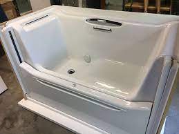 Kohler S Walk In Bathtub Features A Sliding Wall That Makes Getting Into A Bathtub As Easy As Taking A Seat Walk In Tubs Bathtub Walk In Bathtub Tub Shower Combo