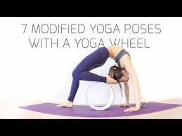 7 Modified Yoga Poses With A Yoga Wheel Youtube Yoga Poses Yoga Wheel Yoga Wheel Guide