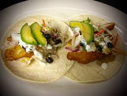 These fish tacos are loaded with fresh flavors from the roasted corn salsa and the creamy avocado sauce. Sunset Grille Photos Sunset Grille