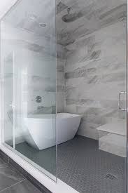 Shower With Freestanding Tub The Master Bathroom Also Features A Large Shower With Horizontal Wall Tile In 2020 Free Standing Tub Large Tile Bathroom Large Shower Tile
