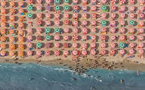 Who is the photographer of the above image photograph? Photographer Bernhard Lang S Aerial Views Shows Beaches From Above