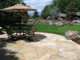 Buff Flagstone Patio With Brick Edger And Natural Boulders By Native Edge Landscapes In Boulder Colorado Backyard Design Patio Flagstone Patio