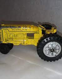 Check out our antique tractor toy selection for the very best in unique or custom, handmade pieces from our vehicles shops. Hubley Cast Yellow Tractor 1950 S 60 S 5 Long The Second Knob Gifts Antiques