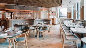 Stone Woodwork And Pops Of Blue Are Teamed Together Inside This French Restaurant And Bar In Restaurant Seating Stools For Kitchen Island Restaurant Interior