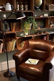 27 Interior Designs With Comfy Chairs Interiorforlife Com Nothing Like A Broken In Leather Chair Home Library Design Leather Living Room Furniture Home Decor