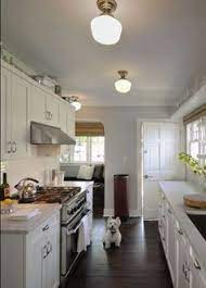 Why not make it inviting? 9 Galley Kitchen Lighting Ideas Galley Kitchen Kitchen Remodel Kitchen
