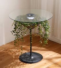 Oasis Table Displays A Hanging Plant Under A Glass Table Top In 2020 Glass Table Glass Top Table Table