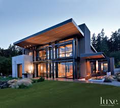 Cantilevered steel beams (packed with wood). Modern Gray Exterior With Steel Beams Luxe Interiors Design