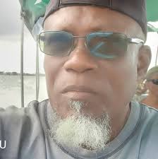 Teachers (left to right) Carlos Juarez, Paul Mahung, Marcial Mes, and Ben  Juarez in small group discussion and reflection activity during a teacher  workshop, 1980s(?).