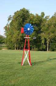 The windmill uses a fully operational rotating wheel to give you an idea of how hard the wind is blowing, plus a top weather vane to indicate the direction of the breeze. 99 In Small Red White And Blue Powder Coated Backyard Windmill Byw0060 The Home Depot Backyard Windmill Ornamental Windmills Windmill Decor