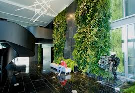 These ferns in front of a thin wooden slat wall this entire apartment living room has been converted into an indoor garden thanks to its huge window. Indoor Wall Natura Towers Von Vertical Garden Design Stylepark