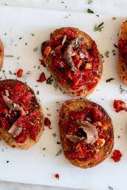 Crostini With Sun Dried Tomato And Anchovy Recipe Nyt Cooking Anchovy Recipes Olive Recipes Tomato Risotto Recipes