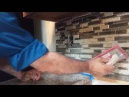 Kitchen update add a glass tile backsplash hgtv. How To Grout A Kitchen Mosaic Tile Backsplash Part 1 Step By Step D I Y Youtube