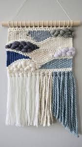 Tapestries and wall hangings come in a range of sizes and often don't require any kind of permanent installation, making them a handy solution. Woven Wall Hanging Weaving Tapestry Wall Art Nursery Decor Home Decor Blue Grey White Neutral Woven Wall Hanging Tapestry Wall Art Wall Weave