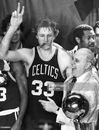 larry bird smokes red auerbach s cigar after the celtics had defeated the rockets to win their 14th nba world championsh larry bird boston celtics red auerbach