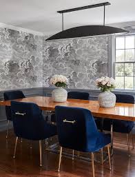 Fornasetti Nuvole Wallpaper Lined With Gray Wainscoting Accents A Gray Contemporary Dining Room Fur Dining Room Blue Trendy Dining Room Blue Dining Room Chairs