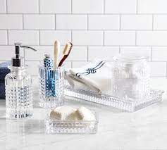 Brush holder can hold toothbrushes or makeup brushes. Pressed Glass Bathroom Accessories Pottery Barn