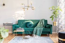 Check spelling or type a new query. Stylish Sunny Decor Of Living Room With Design Green Velvet Sofa Plants Design Commode Accessories Armchair And Pendant Lamp Elegant Interior With Brown Wooden Parquet And Grey Wall Stock Photo Picture And