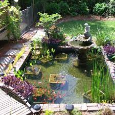 Small pond design with a small waterfall right in the middle of a garden. Creative Diy Koi Pond Ideas You Can Build Yourself To Complement Your Landscape Koi Ponds Designs No 1717 Ponds Backyard Koi Pond Backyard Pond Landscaping