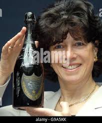 Stephanie Moore, widow of the late Bobby Moore, unveils the bottle of Dom  Perignon 1966 signed