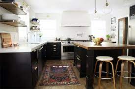 Courtesy of chris loves julia the couple added thin pieces of wood to the fronts of the cabinets to cover all the seams and level the boxes with the top and bottom moldings. It S Done The Full Kitchen Reveal Chris Loves Julia