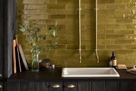 The floor tile coordinates with the lighter tones of the brick. Kitchen Wall Tiles Ideas For Every Style And Budget Loveproperty Com