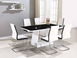 Dining room sets typically include a dining table and a matching set of chairs. Regal Glass Dining Table Set And 6 8 Black Whiteupholstered Contrasting Faux Leather Chairs By Furnitureone 6 White Buy Online In Sweden At Sweden Desertcart Com Productid 71111319