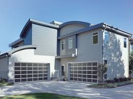 Red garage doors work well for neutral (white or beige) and earth toned exteriors. Modern Aluminum Collection Overhead Door Company