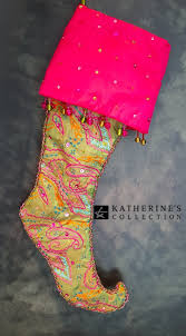 The candy stocking is a red and white striped sock with a green collar. Katherine S Collection Nutcracker Candy Stocking
