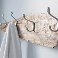 Hold the tape measure at the desired height from step 2 and make two small vertical marks on the wall using a pencil for the hold up the coat rack, and align the mounting holes with the drywall anchors. Super Cheap And Simple Diy Coat Racks Made Out Of Wood