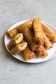 Also known as lumpiang saging (filipino for banana lumpia), is a philippine snack made of thinly sliced bananas (preferably saba or cardaba bananas), dusted with brown sugar, rolled in a spring roll wrapper and fried. Turon Filipino Fried Banana Rolls The Little Epicurean