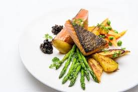 A Delicious And Healthy Salmon Dish At Mediterra Restaurant Taverna Baked Salmon Served With A Colorful Array Of V Salmon Dishes Healthy Salmon Baked Salmon