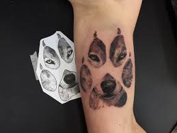 Animal paws are a fairly simple version of a tattoo. Realistic Wolf In Its Paw Print Liam Joseph Tattoo Artist