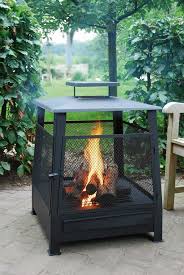 Black grill grate for fun outdoor cooking. Esschert Terrashaard Pagoda Outdoor Fireplace Designs Outdoor Fireplace Patio Fireplace