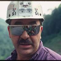 Juddy Allen with Mary Hufford and Lyntha Eiler reflected in his glasses
