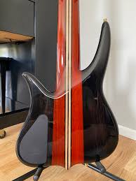 These pics just don't do this bass justice. This beautiful 6-string Surine  Quest NTVII is the result of several back-and-forth conversations with our  good friend and customer, Lawrence Killings. The solid Ebony